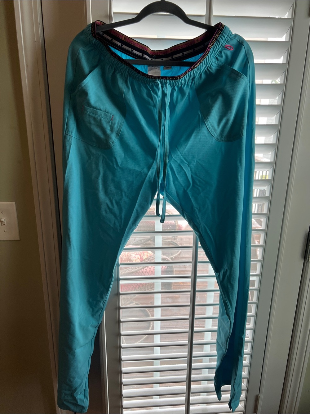 Blue Heartsoul scrub pants.